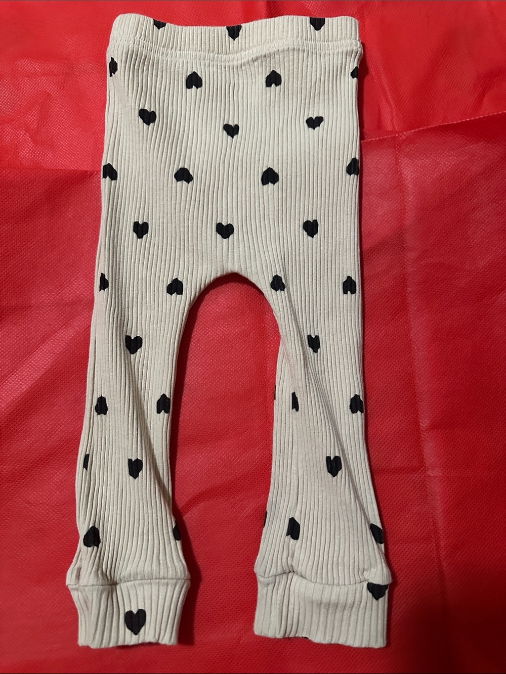 Cream Ribbed Baby One-Piece with Black Heart Print